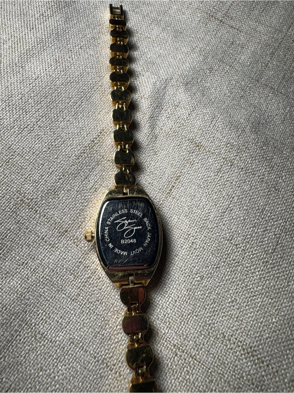 Gold-Tone Garnet Accent Womens Bracelet Watch